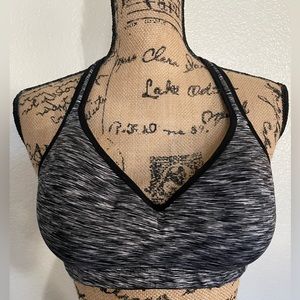 Attraco padded sports bra black, & white, with criss cross straps in the back